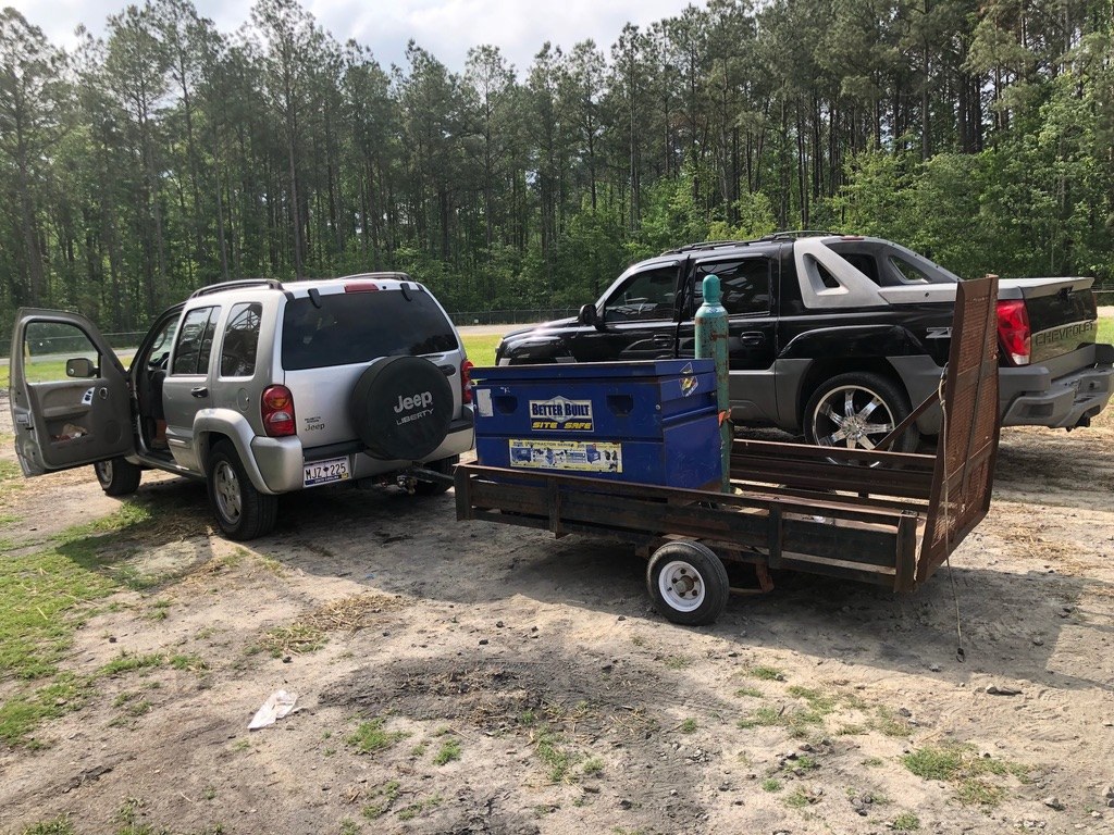 The gray Jeep and trailer that ran the first job in 2018